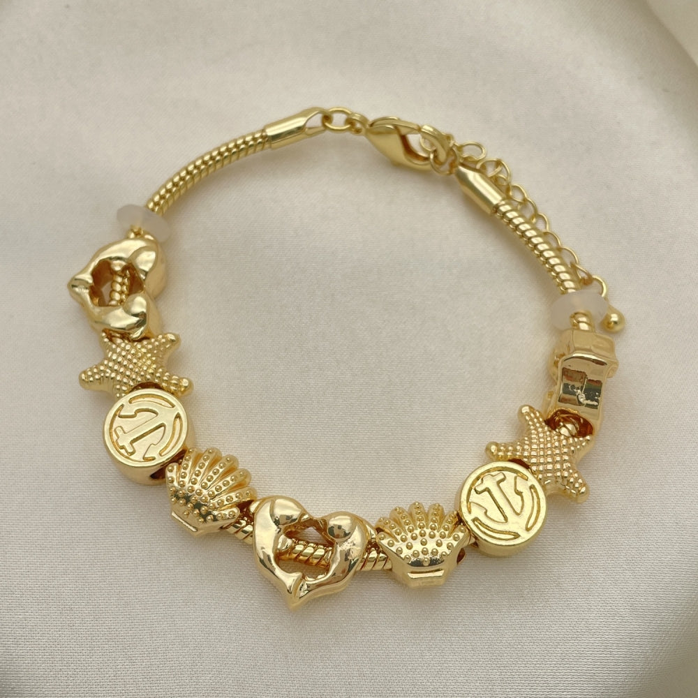 Oro Laminado Fancy Bracelet, Gold Filled Style Dolphin and Shell Design, Polished, Golden Finish