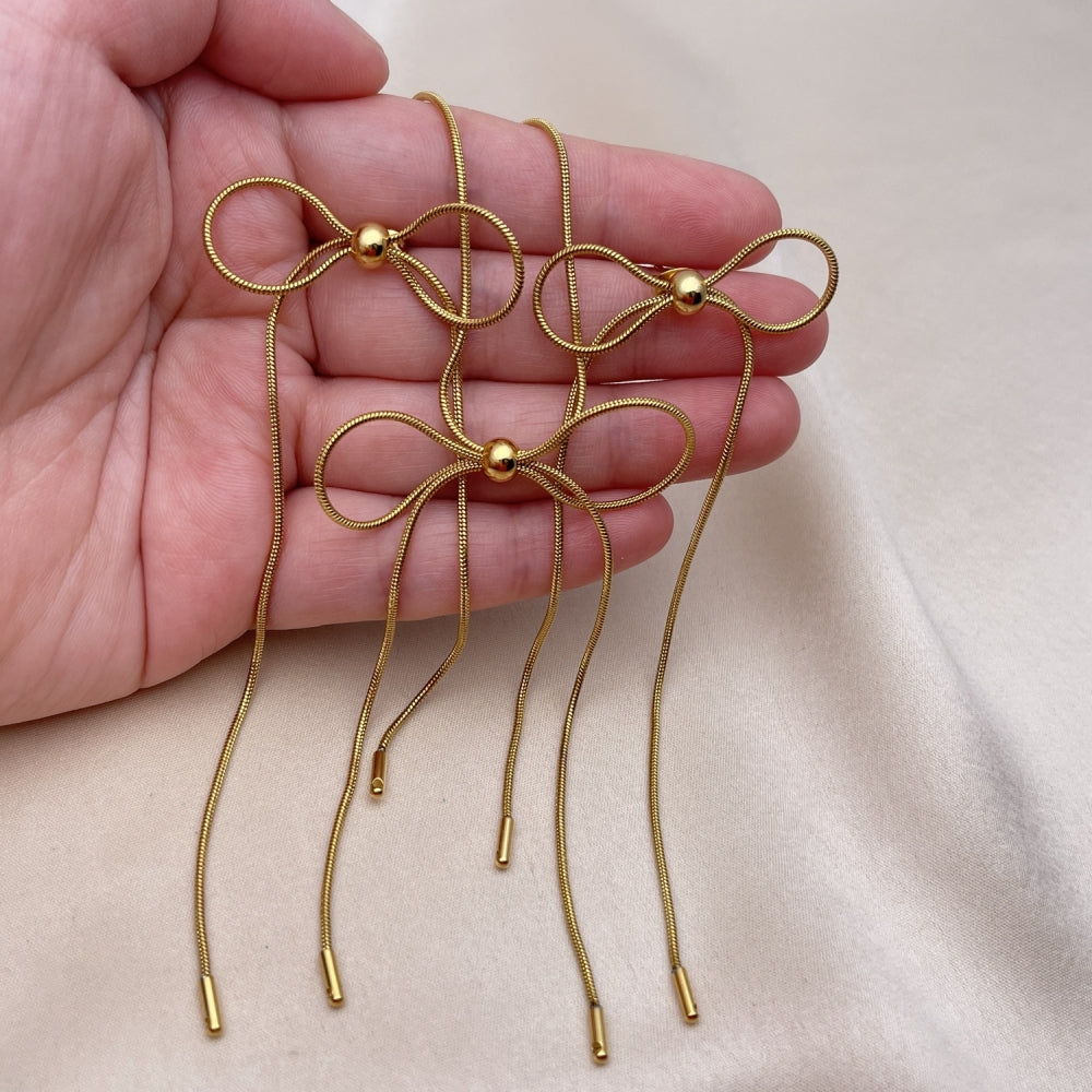 Stainless Steel Necklace and Earring, Bow and Rat Tail Design, Polished, Golden Finish