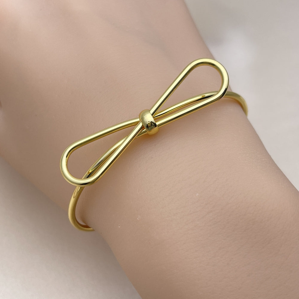Oro Laminado Individual Bangle, Gold Filled Style Bow Design, Polished, Golden Finish