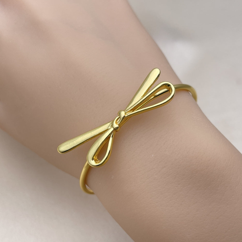 Oro Laminado Individual Bangle, Gold Filled Style Bow Design, Polished, Golden Finish