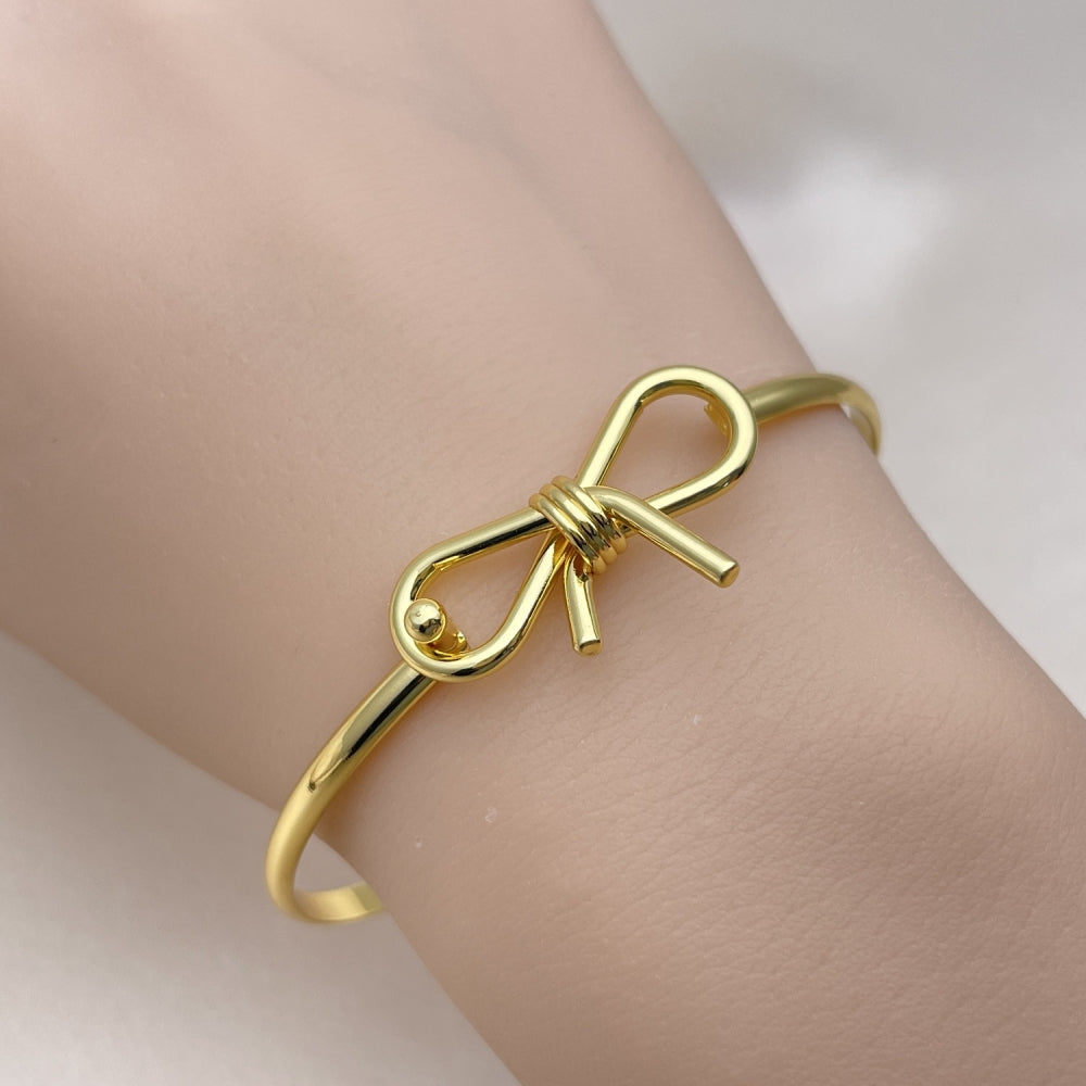 Oro Laminado Individual Bangle, Gold Filled Style Bow Design, Polished, Golden Finish