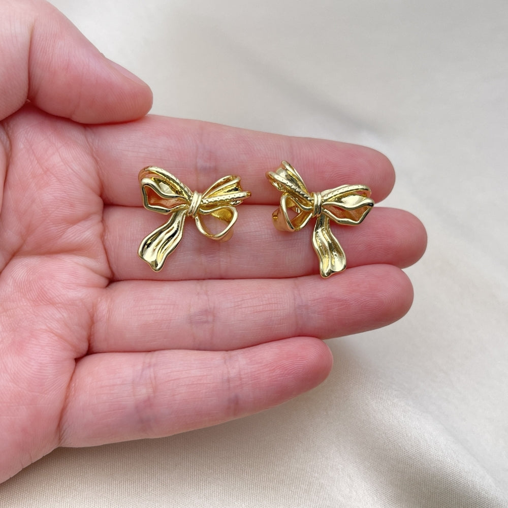Oro Laminado Stud Earring, Gold Filled Style Bow Design, Polished, Golden Finish