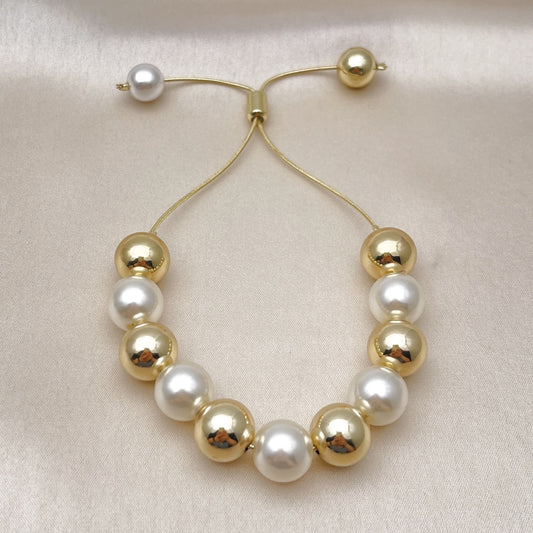 Oro Laminado Adjustable Bolo Bracelet, Gold Filled Style Ball and Rat Tail Design, with Ivory Pearl, Polished, Golden Finish