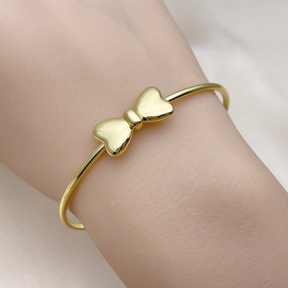 Oro Laminado Individual Bangle, Gold Filled Style Bow Design, Polished, Golden Finish