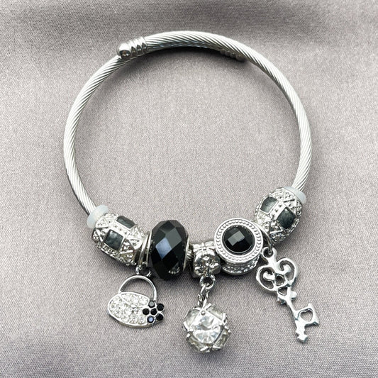 Stainless Steel Individual Bangle, key and Suitecase Design, with White Cubic Zirconia and Jet Crystal, Black Enamel Finish, Rhodium Finish